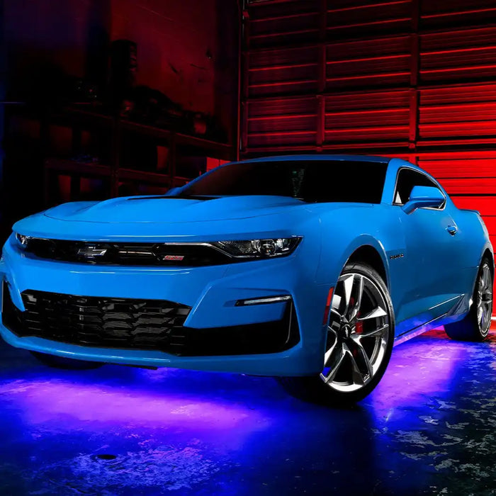 Blue Camaro with purple LED underglow.