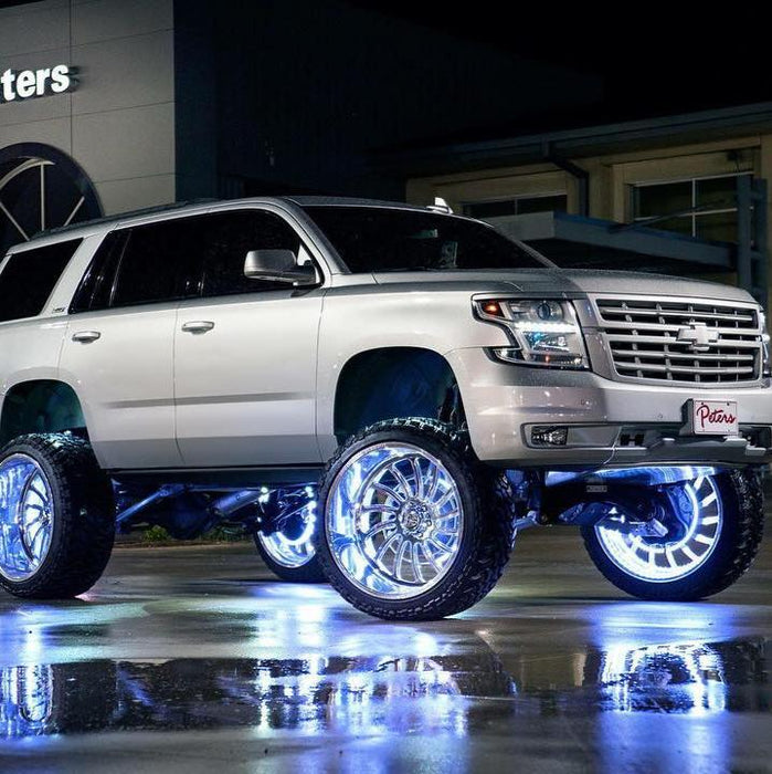 Silver Chevrolet with white wheel rings.