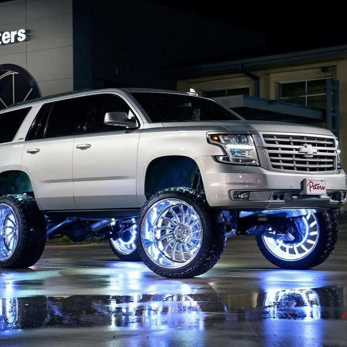 Silver car with white LED wheel rings.