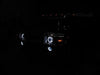 Front end of a Hummer H2 with white LED headlight and fog light halos.