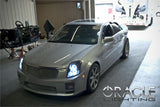 Three quarters view of a Cadillac CTS with white LED headlight halo rings.