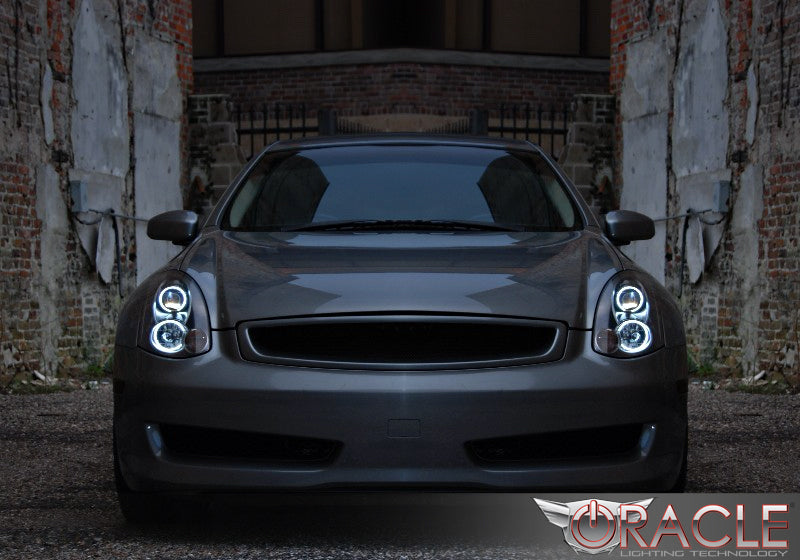 Front end of an Infiniti G35 with white LED headlight halo rings.