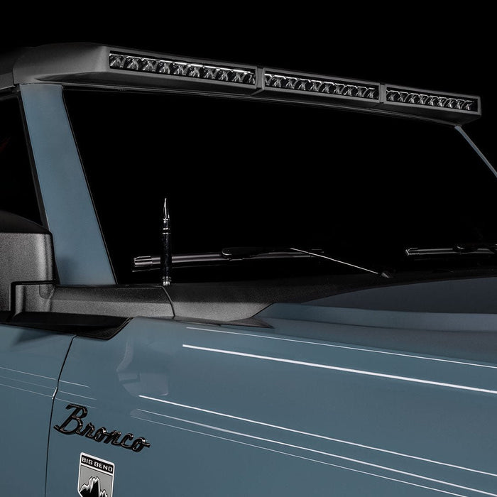 Close-up of a grey Ford Bronco with the Integrated Windshield Roof LED Light Bar System installed.
