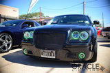 Front end of a Chrysler 300C with green LED headlight and fog light halo rings installed.