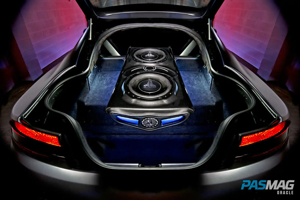 Car with trunk open and speakers inside.