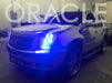 Three quarters view of a Cadillac Escalade with blue LED headlight halo rings.