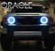 Front view of a Toyota FJ Cruiser with white LED headlight halo rings installed.