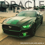 Three quarters view of a black Ford Mustang with green headlight and fog light DRLs.
