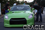 Front of a Nissan GTR with white LED headlight halo rings installed.