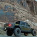 Rear three quarters view of a Jeep Gladiator JT in front of a cliff with Flush Mount LED Tail Lights installed.