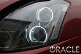 Close-up of a Nissan Maxima headlight with white LED halo rings installed.