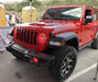 Red jeep in parking lot with bright red halos