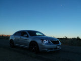 Three quarters view of a Chrysler Sebring with white LED headlight halo rings installed.