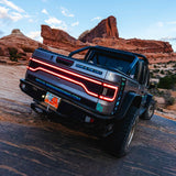 Rear end of a Jeep Gladiator JT equipped with Flush Mount Tail Lights and Racetrack LED Tailgate Panel.