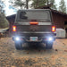 Rear view of a Jeep Gladiator with Rear Bumper LED Reverse Lights turned on.