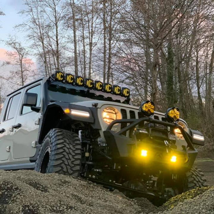 Three quarters view of a Jeep Gladiator with multiple LED lighting products installed, including "Smoked Lens" LED Front Sidemarkers.