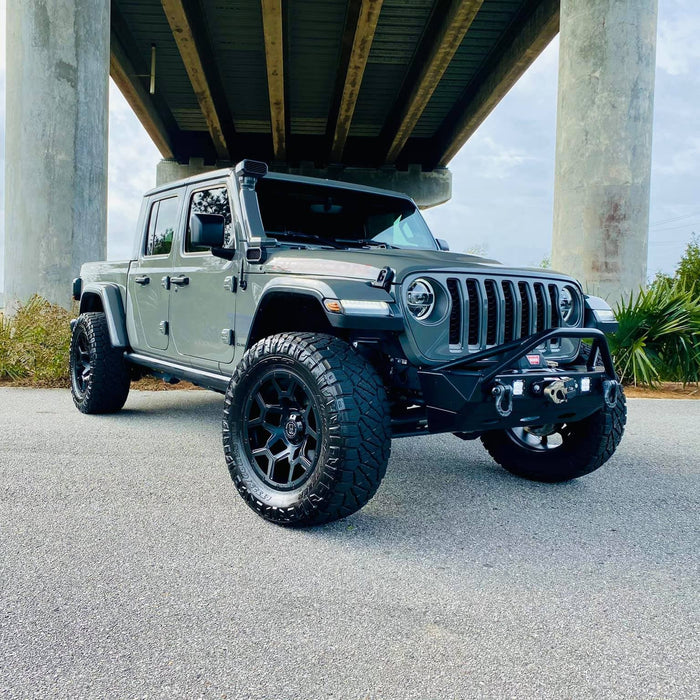 Three quarters view of a Jeep Gladiator JT with multiple LED lighting products installed, including "Smoked Lens" LED Front Sidemarkers.