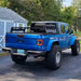 Rear three quarters view of a blue Jeep Gladiator with Flush Mount LED Tail Lights installed.