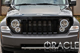 Front end of a Jeep Liberty with white LED headlight halo rings installed.