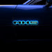 Illuminated LED Letter Badges installed on the side of a car. The letters read: "MX5"