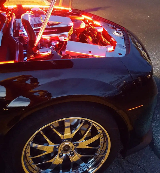Camaro engine bay with red LED lighting.