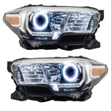 Toyota Tacoma headlights with white LED halo rings.