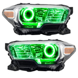 Toyota Tacoma headlights with green LED halo rings.