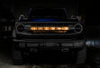Front view of a Ford Bronco with Amber LED Illuminated Letter Badges installed.