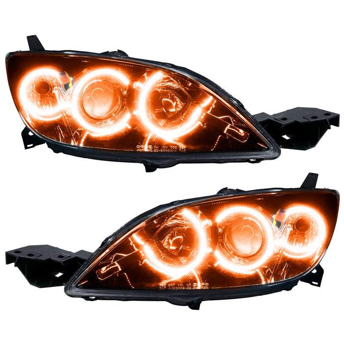 Mazda 3 headlights with amber LED halo rings.