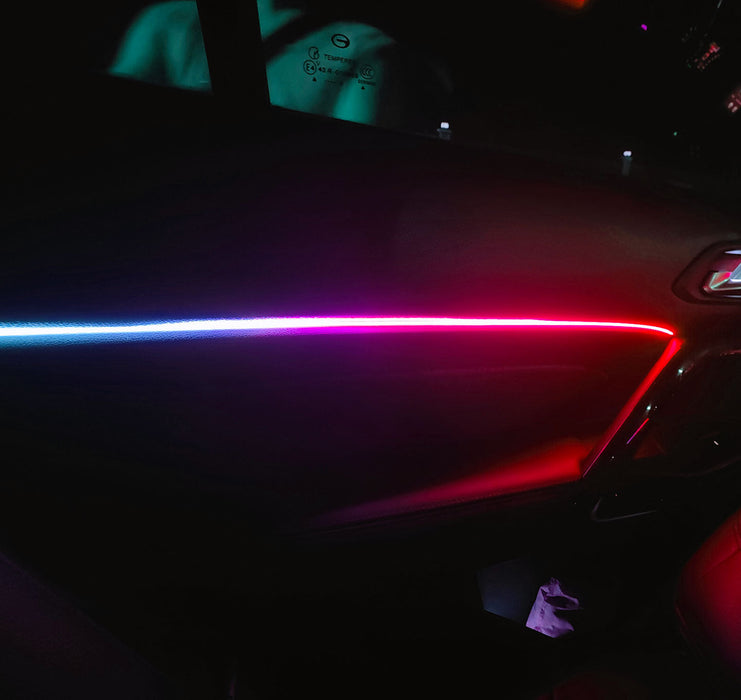 Dynamic ColorSHIFT 18-Piece Universal LED Interior Kit - Bluetooth Multi-Zone Lighting on car door with vibrant colors.