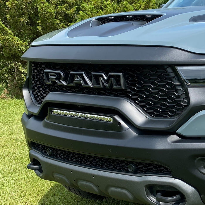 Extreme close-up of of a Front Bumper Flush LED Light Bar System with white LEDs installed on a RAM TRX.