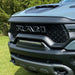 Extreme close-up of of a Front Bumper Flush LED Light Bar System with white LEDs installed on a RAM TRX.
