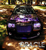 Front end of a Chrysler 300C with white LED headlight and fog light halo rings installed.