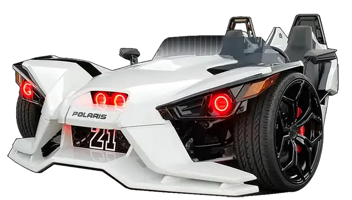 Three quarters view of a Polaris Slingshot equipped with red headlight halo rings.