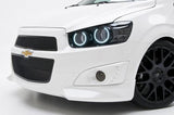 Front end of a Chevrolet Sonic with white LED headlight halo rings installed.