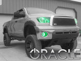 Three quarters view of a Toyota Tundra with green LED headlight halos installed.