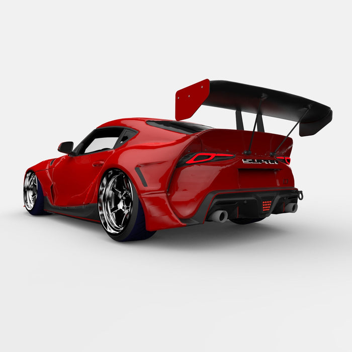Rear view of a red Toyota Supra with Universal Illuminated LED Letter Badges installed above the license plate area.