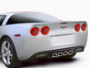 Rear view of C6 Corvette with tail light halos glowing