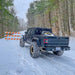 Rear view of a Jeep Gladiator in the snow, equipped with Flush Mount LED Tail Lights.