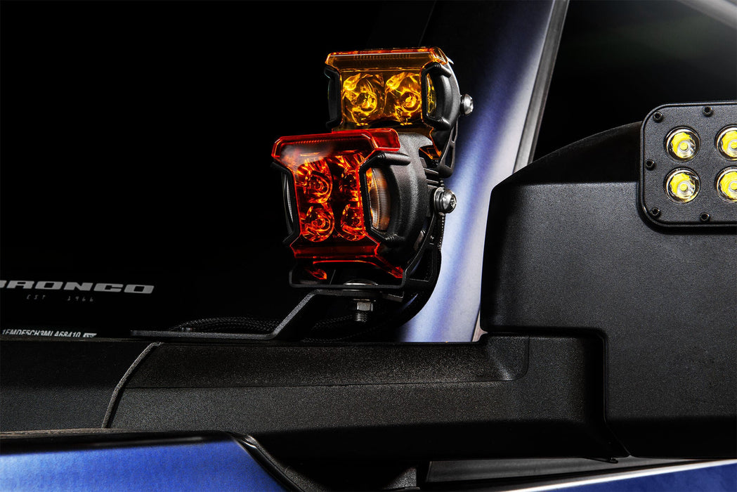 Close up of VEGA Series Spotlights with amber and yellow lens covers snapped on