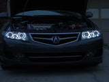 Front end of an Acura TSX with white LED headlight halo rings installed.