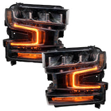 Chevrolet Silverado 1500 headlights with amber DRLs.