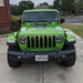 Front end of a green Jeep Gladiator JT with amber Pre-Runner Style LED Grill Light Kit installed.