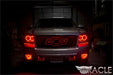 Front view of a Chevrolet Avalanche with red LED headlight and fog light halo rings installed.