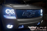 Front end of a Chevrolet Avalanche with white LED headlight and fog light halo rings.