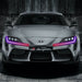 Front view of a Toyota Supra with multicolored headlight DRLs.