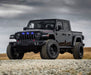 Lifestyle image of a Jeep Gladiator JT with blue Pre-Runner Style LED Grill Light Kit installed.