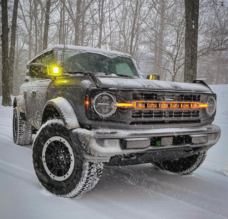 Ford Bronco in snowy weather with glowing orange amber LED letter badges