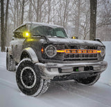 Ford Bronco in snowy weather with glowing orange amber LED letter badges