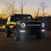 Ford Bronco outside with headlights and fog lights on